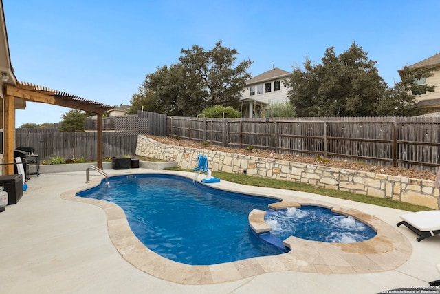 view of pool featuring an in ground hot tub and a patio