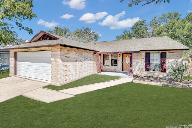 ranch-style home with a front lawn and a garage