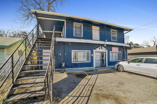 811 General Mcmullen Dr, San Antonio, TX 78237 - view of front of home featuring stairway and a balcony