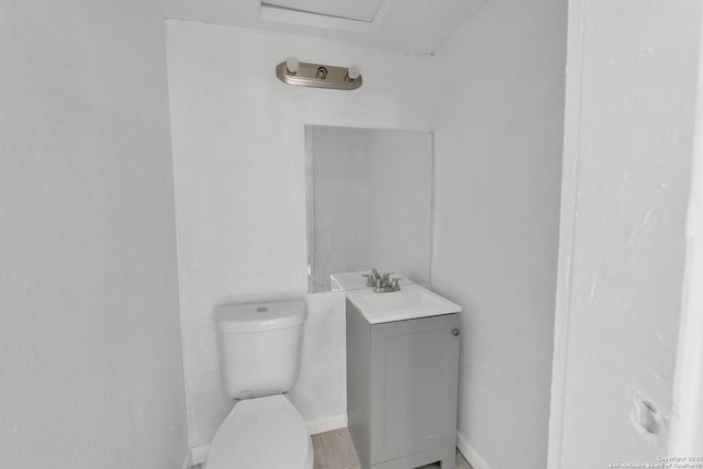 811 General Mcmullen Dr, San Antonio, TX 78237 - half bathroom featuring baseboards, vanity, and toilet