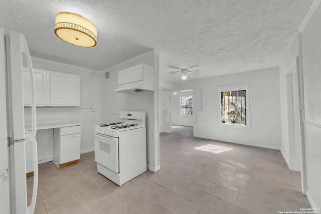 811 General Mcmullen Dr, San Antonio, TX 78237 - kitchen featuring white appliances, ceiling fan, light countertops, white cabinets, and baseboards