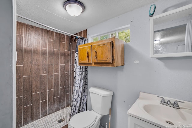 bathroom with vanity, toilet, and a shower with shower curtain