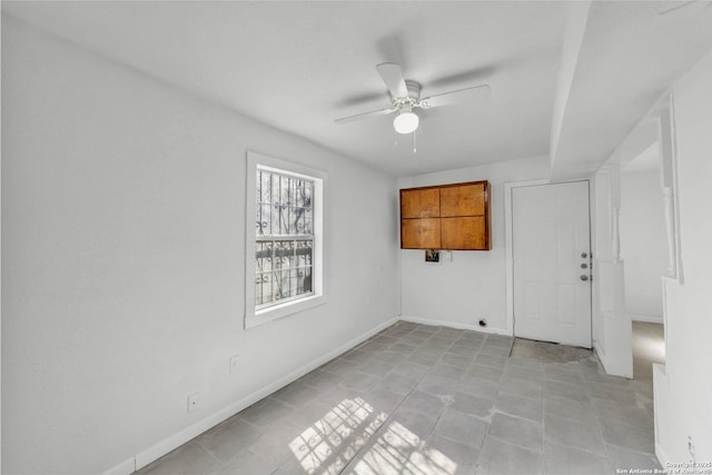 811 General Mcmullen Dr, San Antonio, TX 78237 - spare room featuring ceiling fan, baseboards, and light tile patterned floors