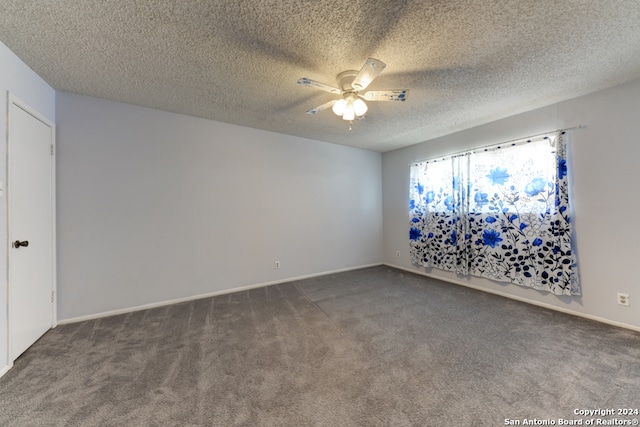 carpeted empty room with a textured ceiling and ceiling fan