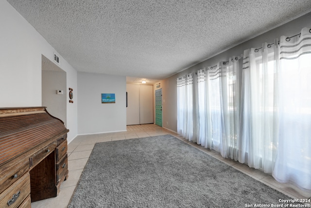 interior space featuring a textured ceiling