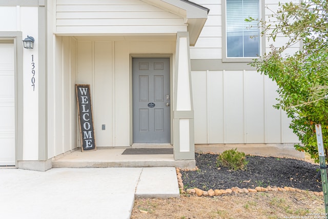 view of exterior entry featuring a garage