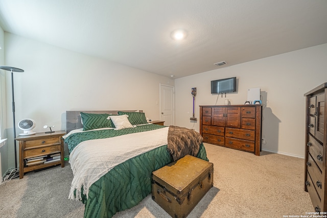 bedroom featuring light colored carpet