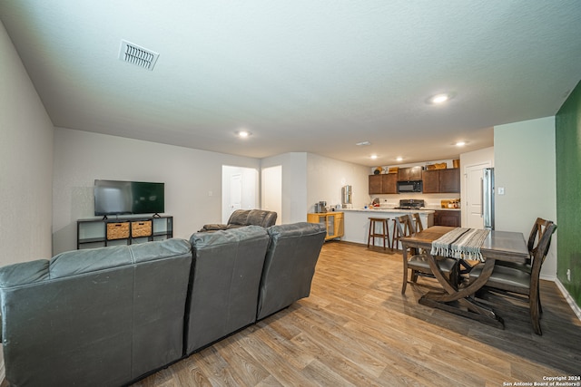 living room with light hardwood / wood-style floors