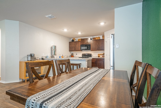 dining space featuring hardwood / wood-style flooring