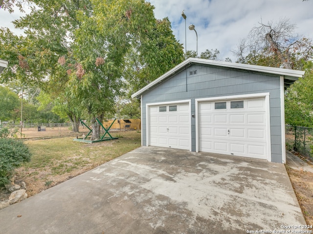 garage with a lawn