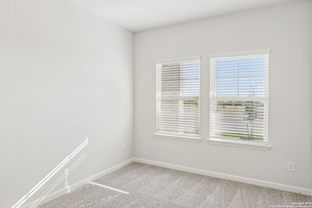 unfurnished room featuring carpet flooring