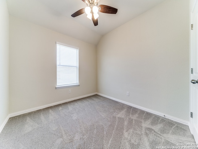 unfurnished room featuring carpet floors, ceiling fan, and vaulted ceiling