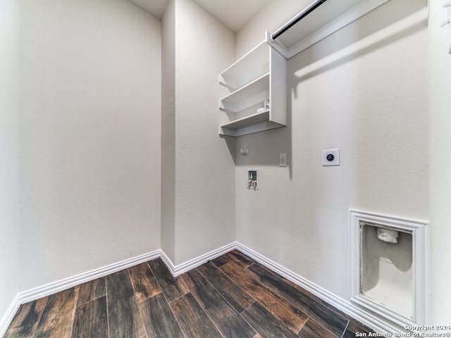 washroom featuring hookup for an electric dryer, dark hardwood / wood-style flooring, gas dryer hookup, and hookup for a washing machine