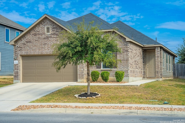 view of front facade featuring a front lawn and a garage