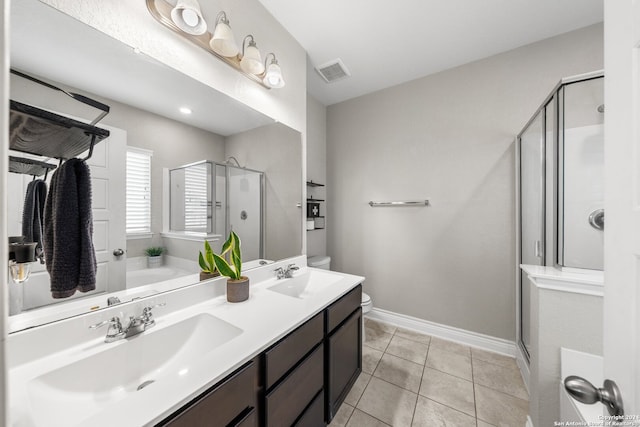 bathroom with vanity, independent shower and bath, and tile patterned flooring