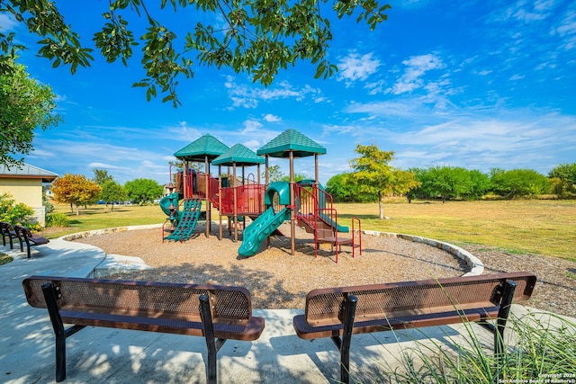 view of jungle gym featuring a lawn