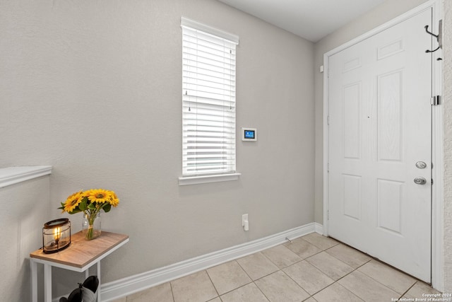 entrance foyer with light tile patterned floors