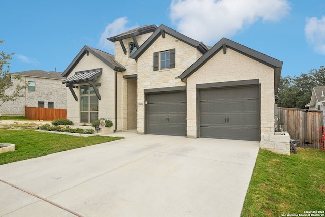 view of front facade featuring a front lawn and a garage