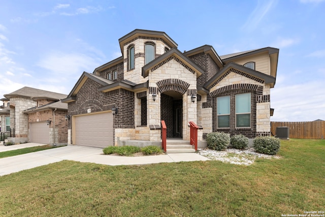 view of front of home with a front yard and a garage