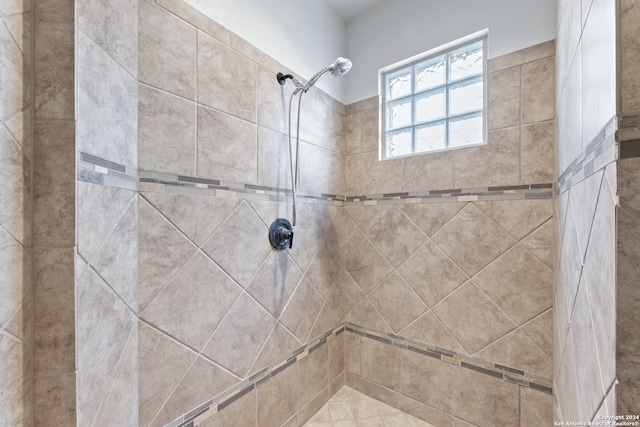 bathroom with tiled shower