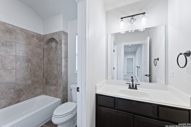 full bathroom with vanity, toilet, and tiled shower / bath