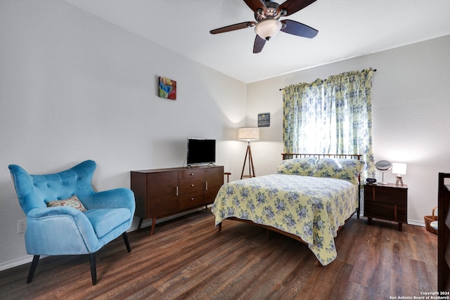 bedroom featuring ceiling fan and dark hardwood / wood-style floors