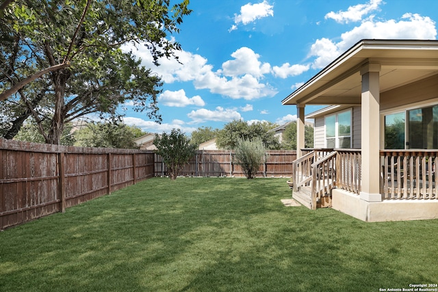 view of yard with a wooden deck