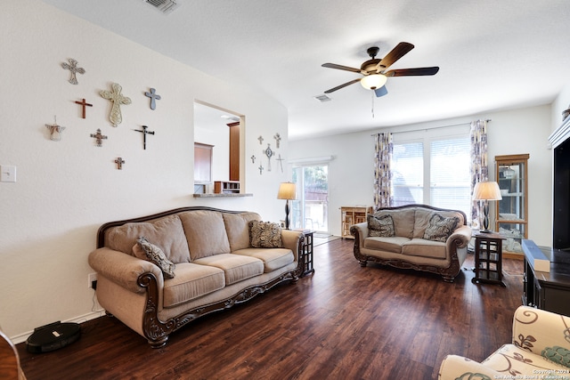 living room with ceiling fan and dark hardwood / wood-style floors