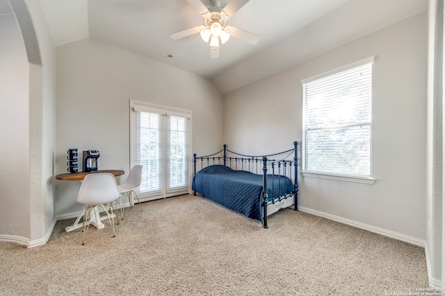 bedroom featuring carpet, vaulted ceiling, and ceiling fan