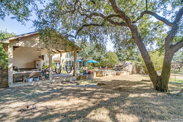 view of yard with ceiling fan