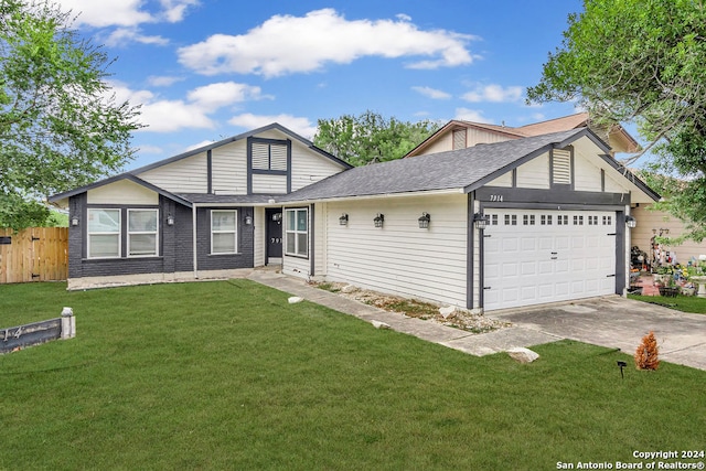 view of front facade with a front yard and a garage