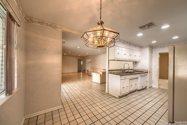 kitchen with white cabinetry, fridge, dishwasher, a notable chandelier, and decorative light fixtures