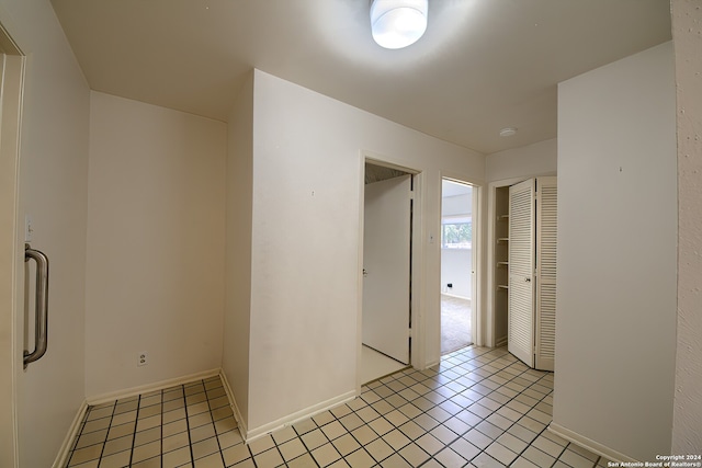 empty room with light tile patterned floors