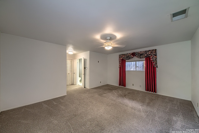 carpeted empty room with ceiling fan