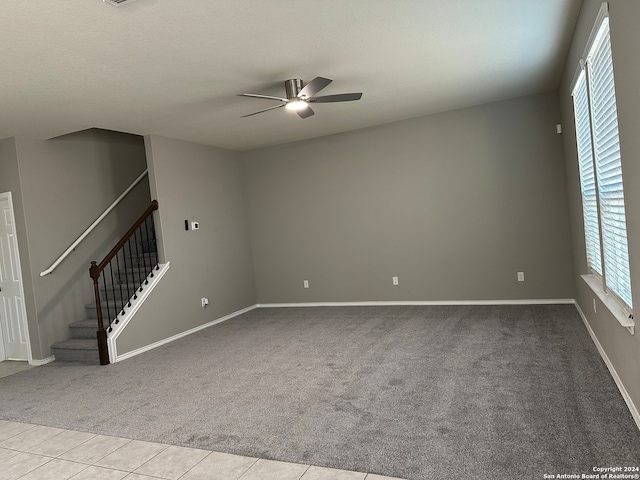 carpeted empty room with ceiling fan