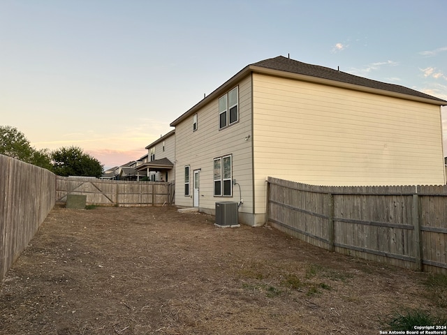 back house at dusk with central AC