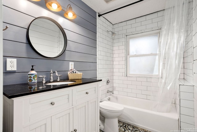 full bathroom with toilet, vanity, shower / tub combo with curtain, and wooden walls