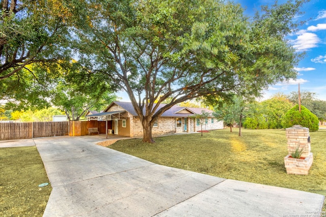 ranch-style house with a front yard