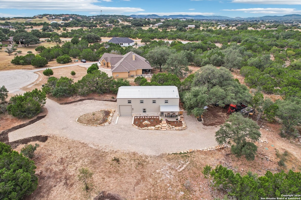 birds eye view of property with a mountain view