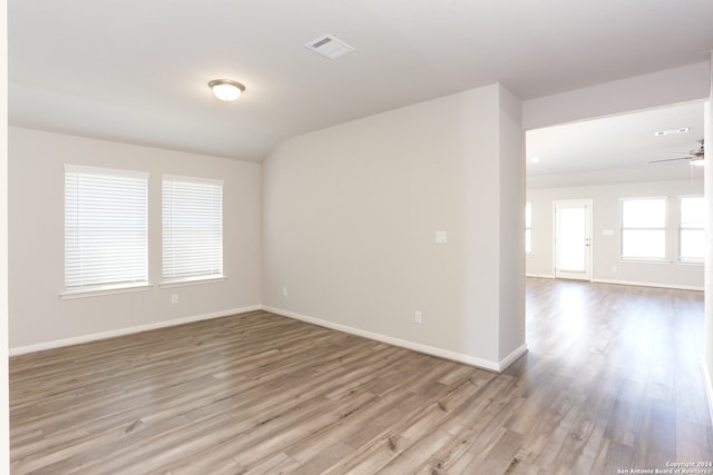 spare room with light hardwood / wood-style flooring and ceiling fan