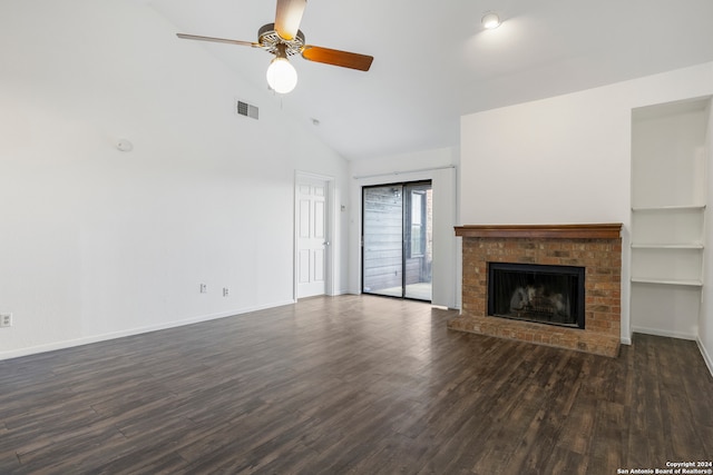 unfurnished living room featuring a fireplace, dark hardwood / wood-style flooring, built in shelves, high vaulted ceiling, and ceiling fan