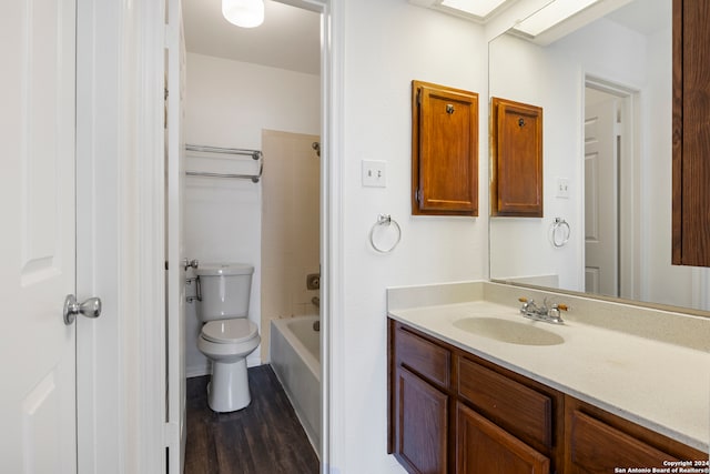 full bathroom with vanity, wood-type flooring, toilet, and tub / shower combination