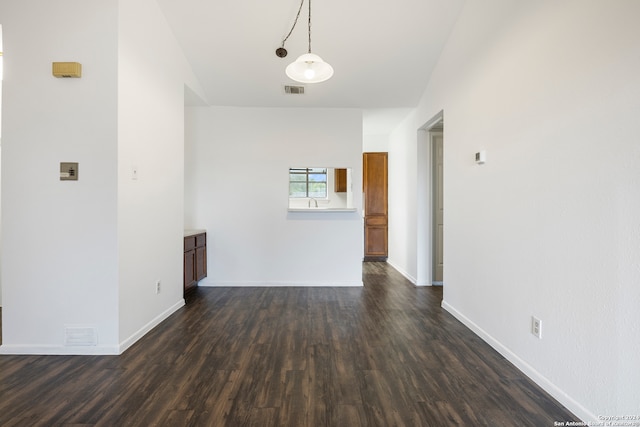 spare room with dark hardwood / wood-style floors