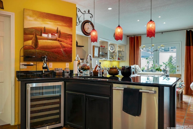 kitchen with sink, dishwasher, a textured ceiling, wine cooler, and tile patterned flooring