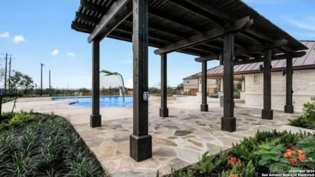 view of patio / terrace featuring a community pool