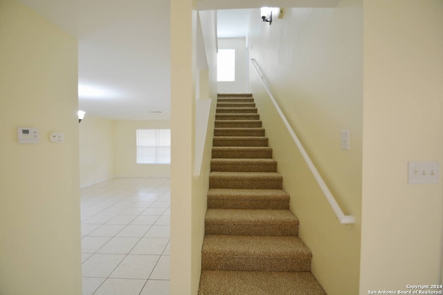 staircase with tile patterned flooring