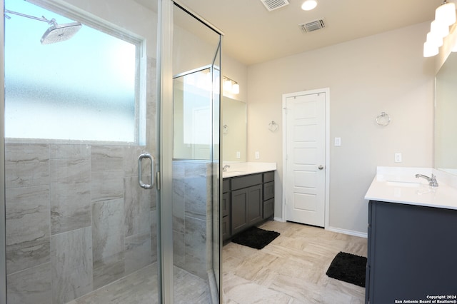 bathroom with vanity and walk in shower