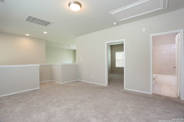 unfurnished room with light colored carpet