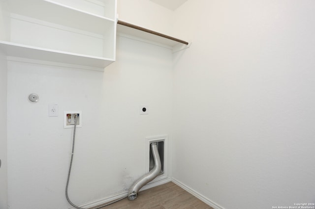 laundry area with hardwood / wood-style floors, electric dryer hookup, gas dryer hookup, and hookup for a washing machine