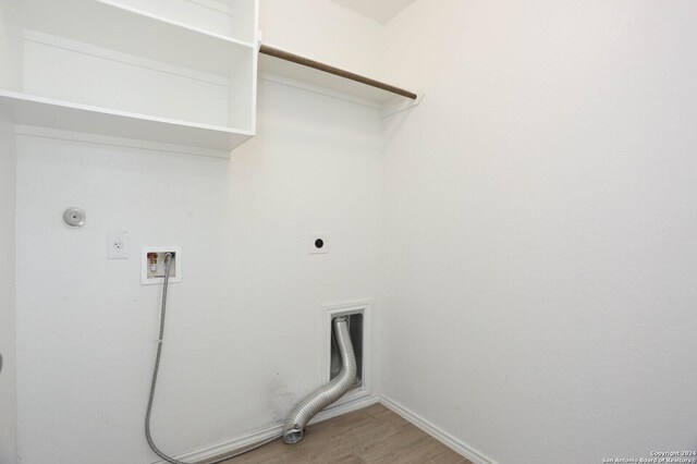 2615 Barkey Spgs, San Antonio, TX 78245 - laundry room with hookup for an electric dryer, light wood-style floors, gas dryer hookup, laundry area, and washer hookup